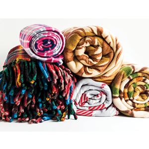 stack of rolled fleece blankets