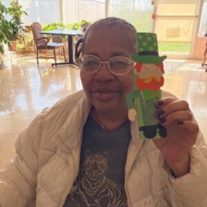 Madison Nursing and Rehabilitation Resident pictured with Small Leprechaun craft for St. Patrick's Day
