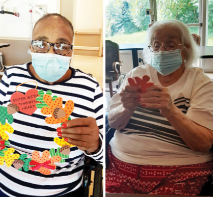 Madison Nursing and Rehab residents with their fall crafts