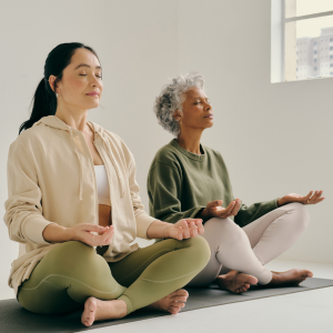 image of two females sitting in meditation stance