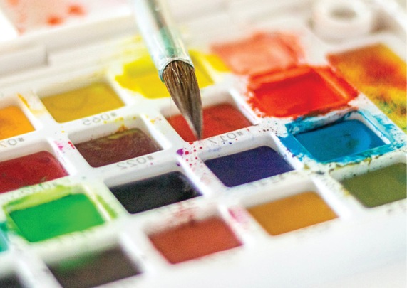 watercolor palette and paintbrush